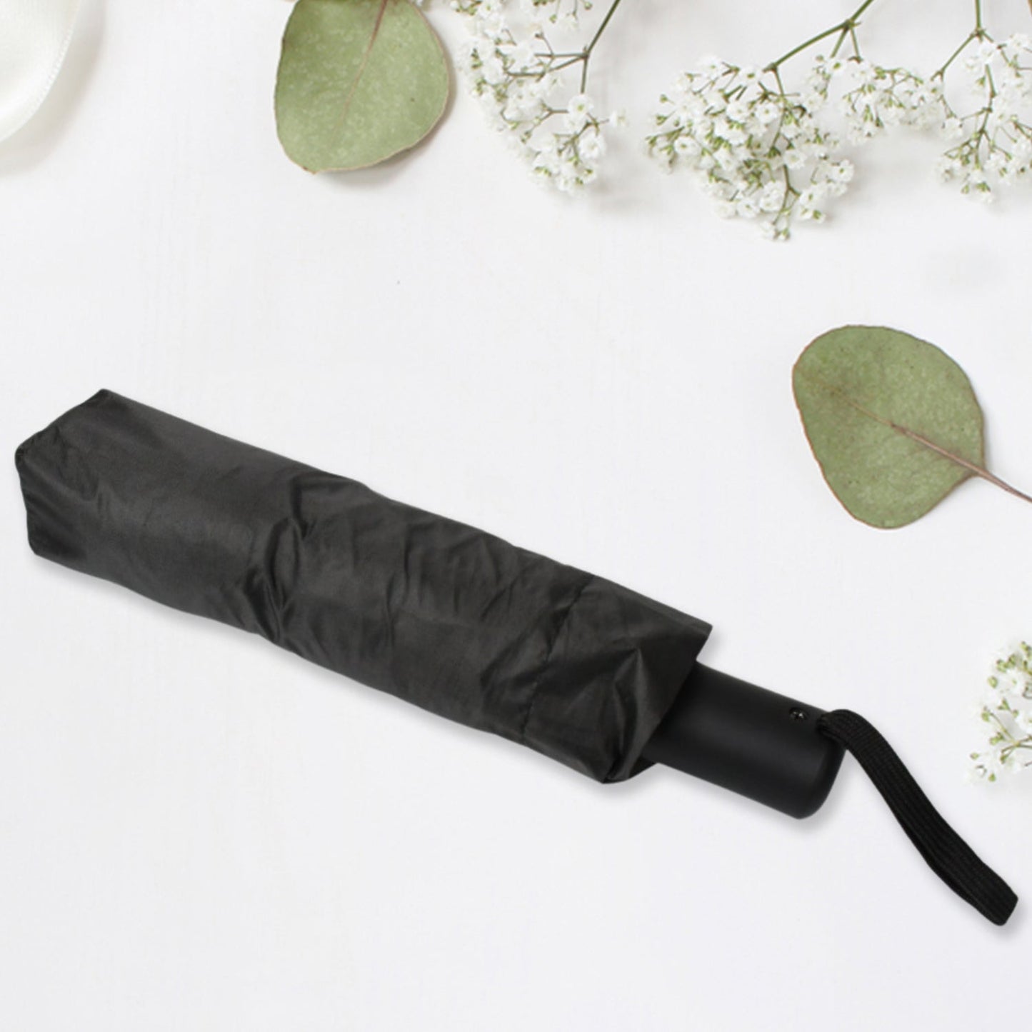 Compact Black windproof 2-fold umbrella, sunproof and rainproof, with a sturdy steel shaft and wrist strap. Lightweight and easy to carry