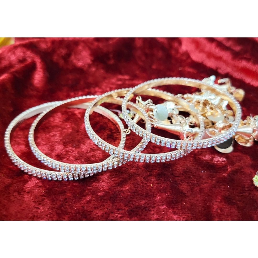 Gold-Plated Stone Studded Metal Latkan Bangle Set - Absolutely Desi