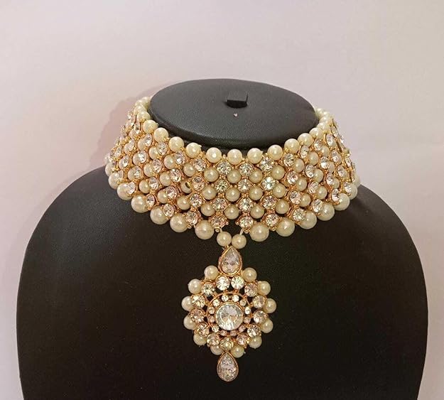 Gold-plated long traditional pearls necklace set with earrings and maang tika for women and girls.