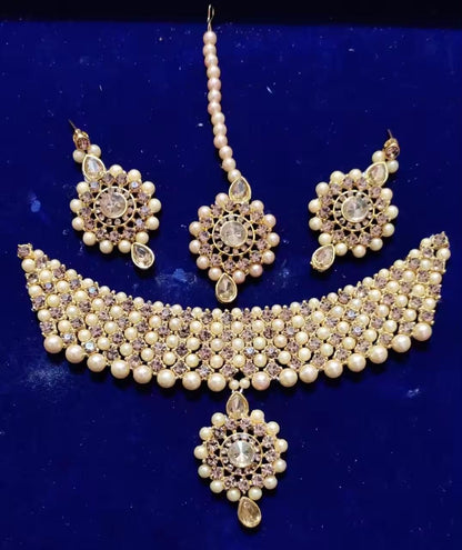 Gold-plated long traditional pearls necklace set with earrings and maang tika for women and girls.